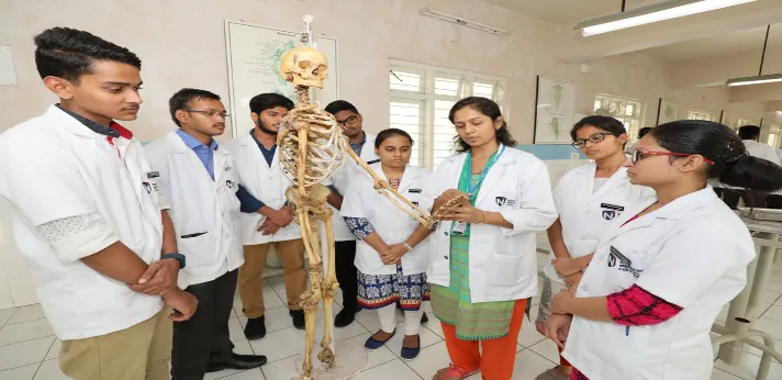 Goa medical college Students are being shown a demonstration of skeleton parts in the anatomy lab.